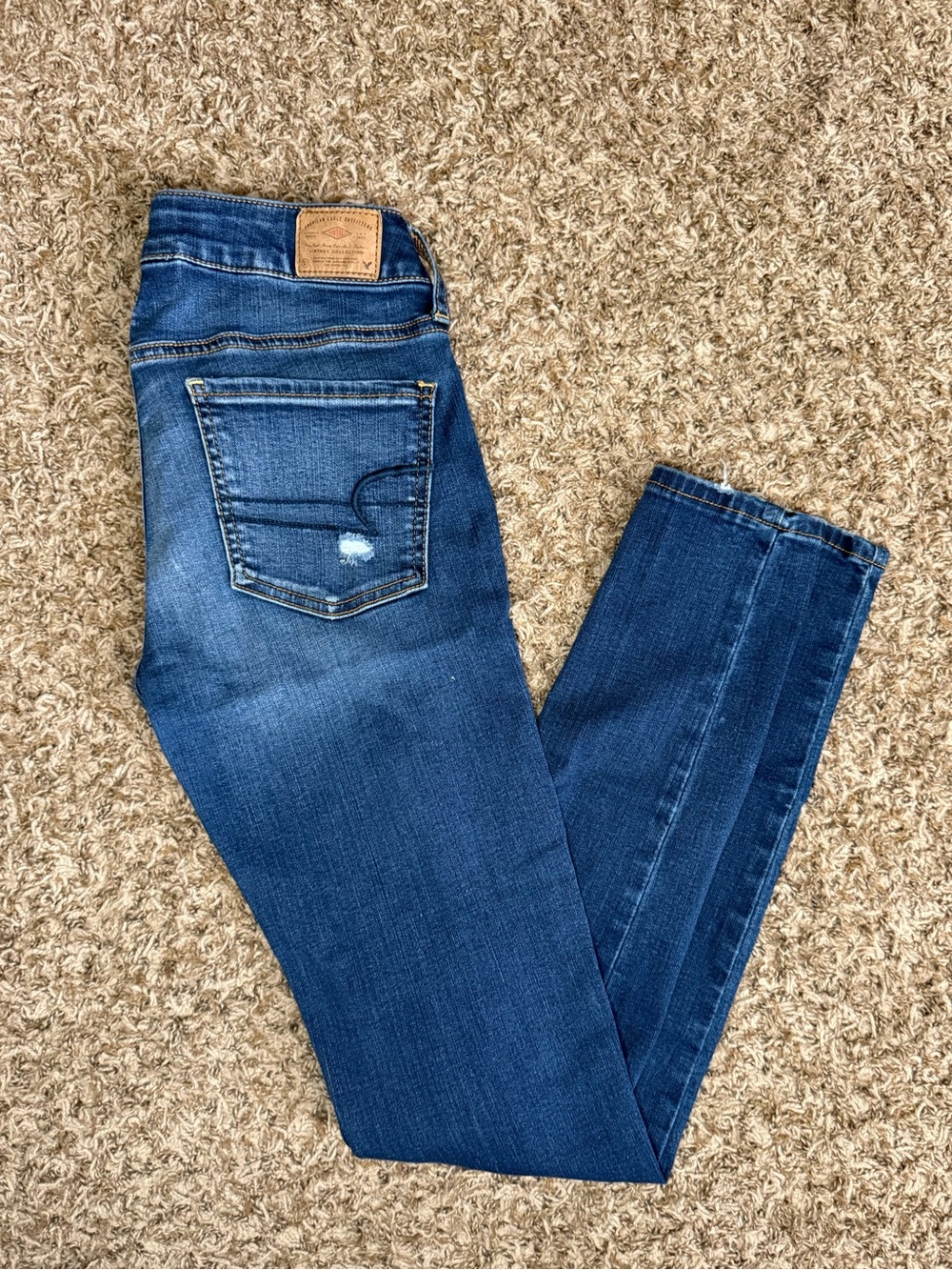 AEO Distressed Dark Blue Skinny Jeans